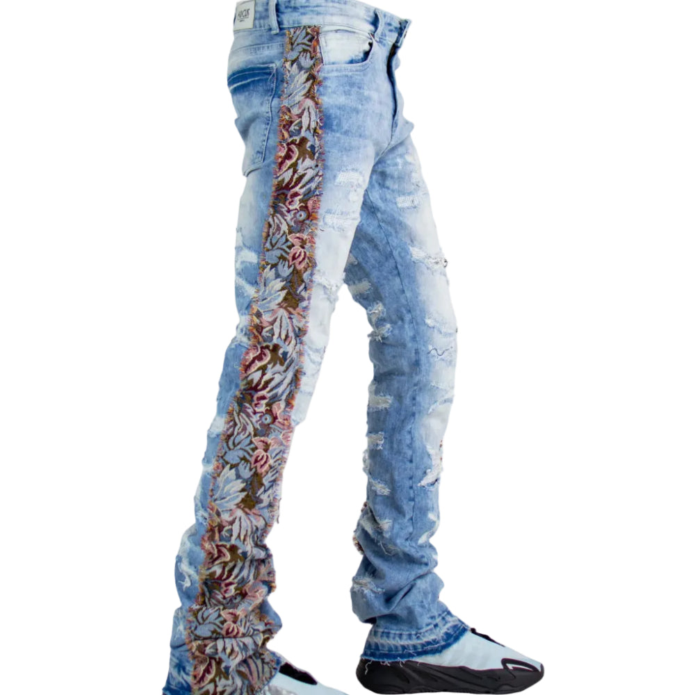 Light blue distressed jeans with floral pattern on a white background